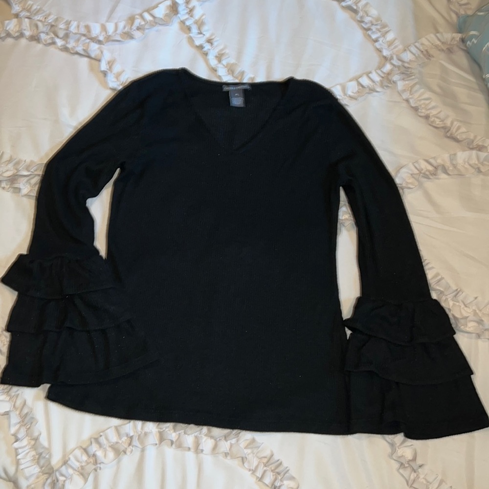 Nice light weight fabric with triple ruffle at bottom of sleeves!